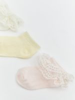 Baby girl's three-pack of sock booties with lace detailing. - Image 2