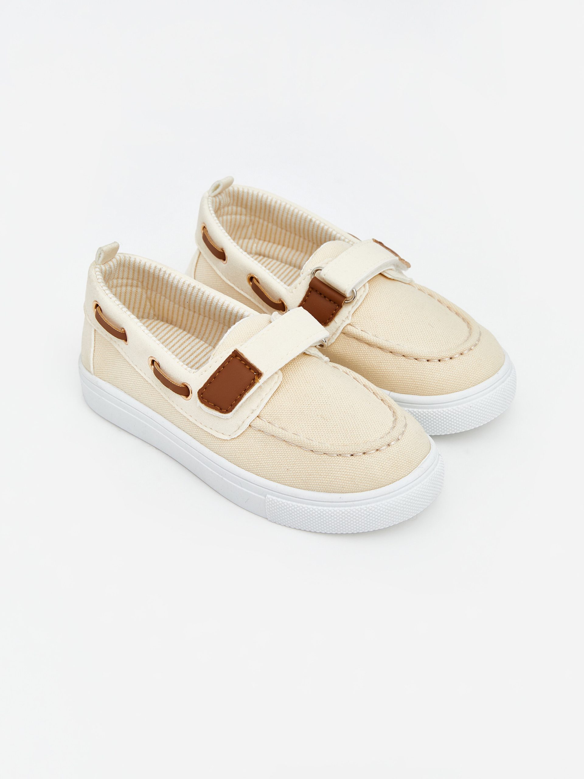Classic baby boy shoes with hook and loop fasteners.